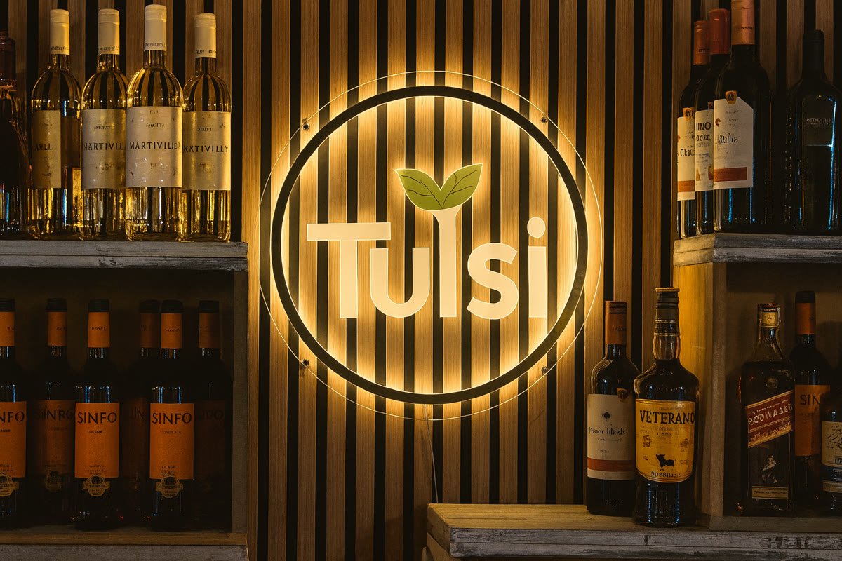 Letrero luminoso de Tulsi junto a la bodega